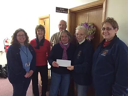 Accepting a donation from Solvay Fire Dept. Womens Auxiliary.